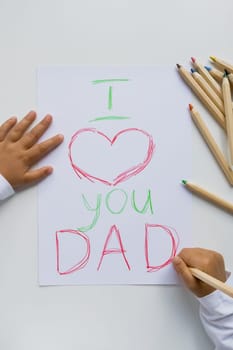 Child handwritten I love you dad drawing with colorful pencils. Father day.