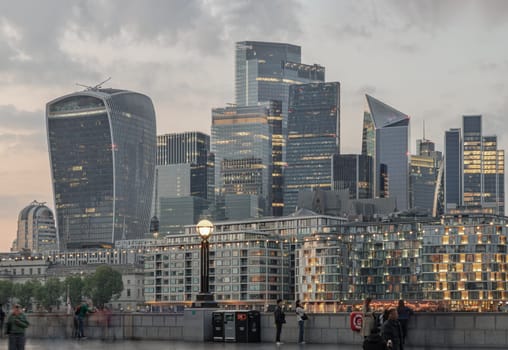 London, UK - Apr 27, 2025 - The Picturesque view of The Skyscrapers of Financial District by River Thames after sunset in City of London. use it as your Wallpaper, Poster and Copy space. Selective focus.