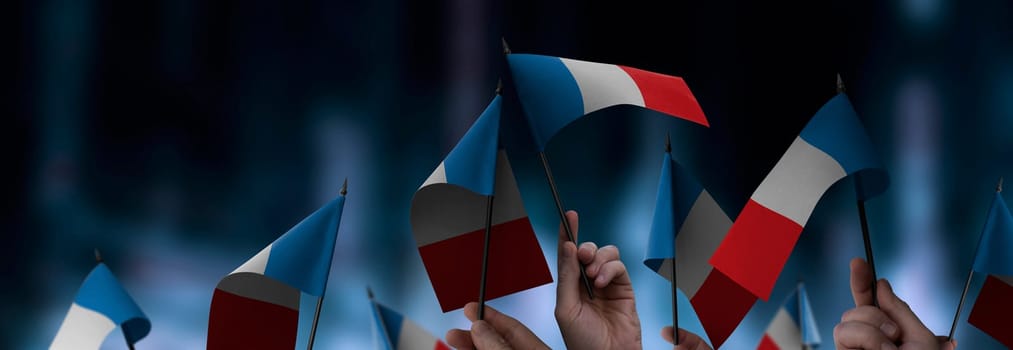 France flags in their hands on a blurred urban background. The photo illustration was created without the use of artificial intelligence, only using Photoshop.