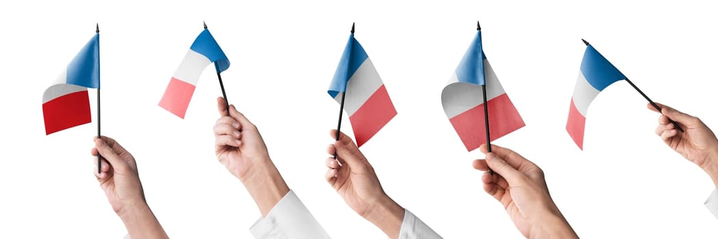The France flag in hand in different angles on a white background.
