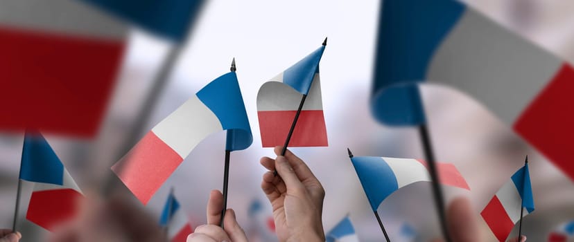 France flags in their hands on a blurred urban background. The photo illustration was created without the use of artificial intelligence, only using Photoshop.