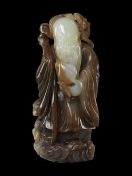19th-century Chinese carving of Shoulao, the God of Longevity, in variegated jade. Holds a staff and peach, symbols of long life.