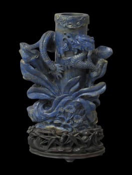 Ornate 18th-century Chinese vase carved from deep blue lapis lazuli, featuring intricate dragon and wave motifs. Rich color, detailed craftsmanship.