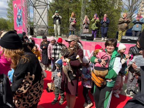 Moscow, Russia, April 27, 2025: Visitors and volunteers take part in a charity parade for French Bulldogs, supporting rescue initiatives and raising awareness for animal welfare