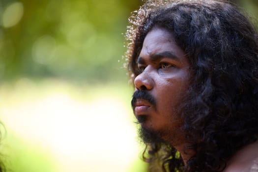 Vedda tribesman of Sri Lanka stands in natural surroundings, representing indigenous culture, traditional lifestyle, and connection to nature. Tribal portrait in native Habitat. 02.03.2022 SRI LANKA.