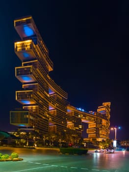 UAE, Dubai, 25 October 2024: The luxury hotel Atlantis the Royal at night, architecture of the city at night, skyscrapers with glass facades. High quality photo