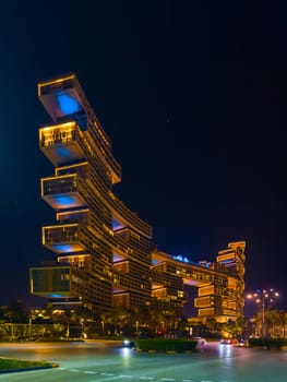 UAE, Dubai, 25 October 2024: The luxury hotel Atlantis the Royal at night, architecture of the city at night, skyscrapers with glass facades. High quality photo