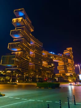 UAE, Dubai, 25 October 2024: The luxury hotel Atlantis the Royal at night, architecture of the city at night, skyscrapers with glass facades. High quality photo