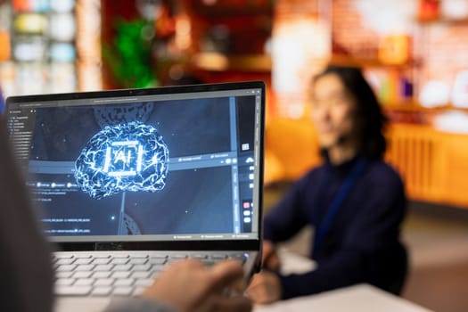 Call center worker uses AI technology on laptop to generate call scripts during conversation with customers. Customer service agent using AI tech on notebook to summarize clients issues