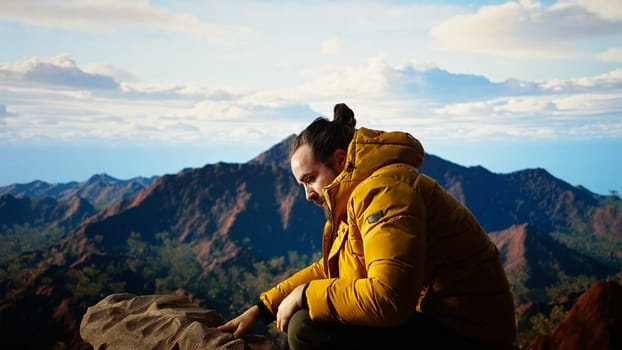 Clumsy mountain hiker dropping his phone due to lack of attention, unequipped traveler defocusing and being reckless. Modern person in the nature obsessed with technology. Camera A.