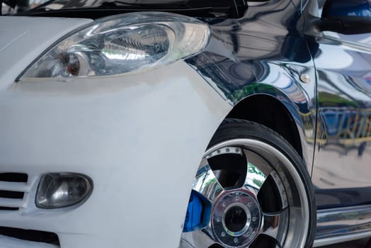 Denter or car mechanic serviceman check and fix body work and fiber bumper body part for fix and repair problem at car garage or repair shop