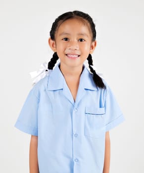 Portrait smiling Asian little girl kindergarten studio shot isolated white background, good job feedback, happy woman kid in pigtails wearing school uniform, back to school concept