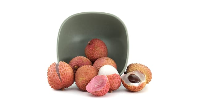 A vibrant display of fresh lychee fruits arranged in a stylish bowl, perfect for highlighting tropical flavors and exotic cuisine.