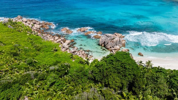 Tropical sandy beach and blue sea. Anse Cocos. Seychelles, La Digue.