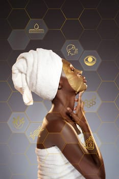 A woman with a towel on her head is applying a gold facial mask, highlighting her profile. She enjoys a peaceful moment dedicated to skincare, emphasizing self-care and relaxation.