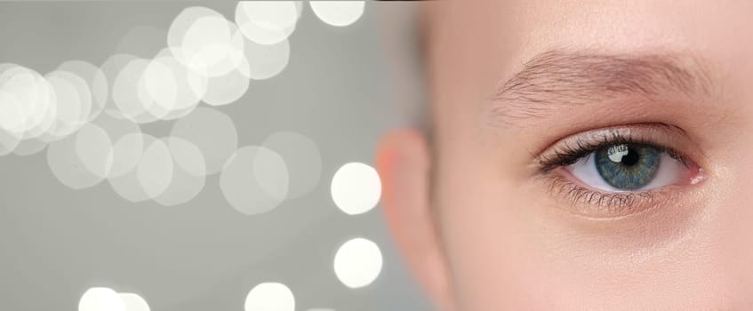 A close-up view of a person's eye showcases intricate details such as the vibrant iris and delicate eyelashes.