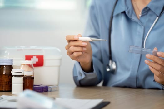 A healthcare professional assesses a patient's health using a thermometer and medication, emphasizing wellness and care.