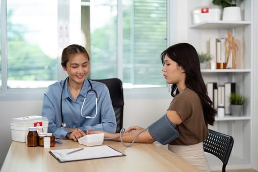 A nurse measures a patient's blood pressure during a consultation, focusing on health monitoring and patient care.