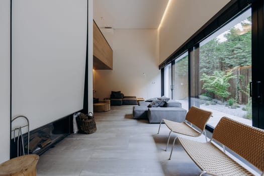 This living room features a comfortable couch, several chairs, and a warmthinducing fireplace, creating a cozy atmosphere for relaxation