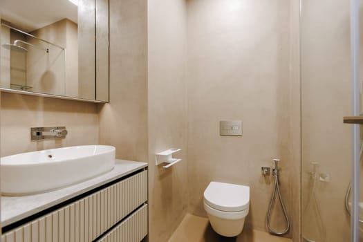 A welldesigned bathroom that includes essential fixtures such as a toilet, a sink, and a shower for complete functionality and comfort