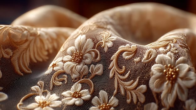 Close-up of luxurious lace fabric with intricate floral embroidery in gold tones, draped in soft folds and illuminated by warm, natural light.