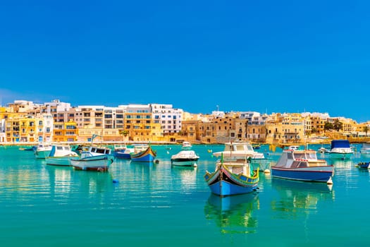 A view of numerous fishing boats in St George's Bay in Birzebbuga, a small coastal town in Malta.