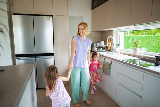 Lively morning in a stylish kitchen with children playing.