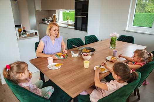 Sharing laughter and delicious food in a cozy kitchen