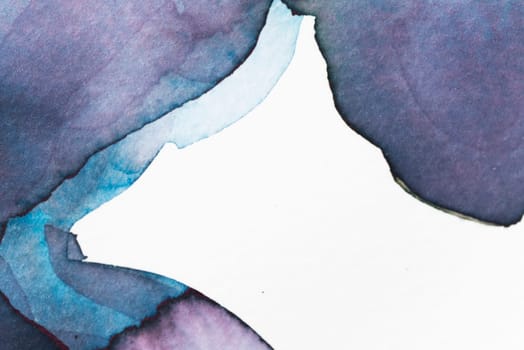 Swirls of blue and violet watercolor create an abstract composition on textured paper, emphasizing fluid shapes and vibrant colors.