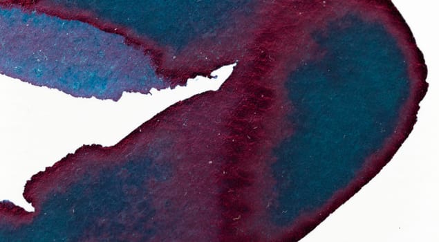 A vibrant blend of deep blue and burgundy watercolor creates an organic pattern on textured paper. The smooth flow of colors captures the essence of creative expression in a tranquil setting.
