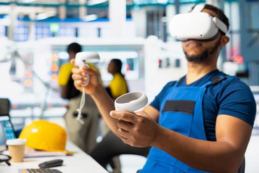 Solar panel factory specialist monitoring production line and performance using virtual reality high tech gear. Photovoltaics plant specialist employs VR headset for manufacturing.