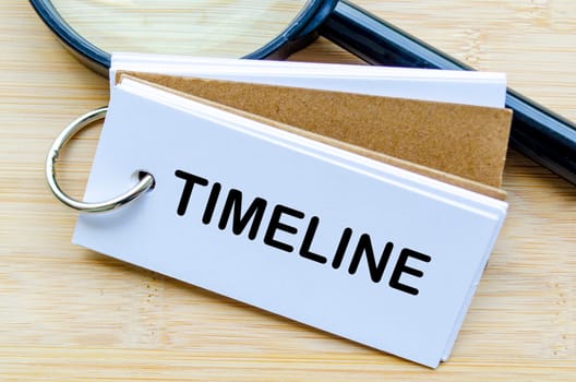 Timeline text on notepad denoting deadlines or time related matters.