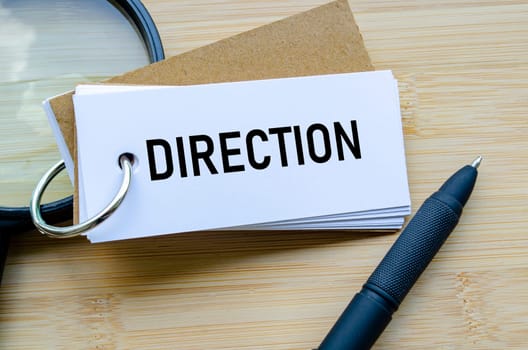 Direction text on notepad showing strategic movement and future planning.