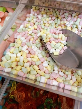 Colorful candy assortment at market sweets shop stall, candy store, fruit jelly candies. High quality photo