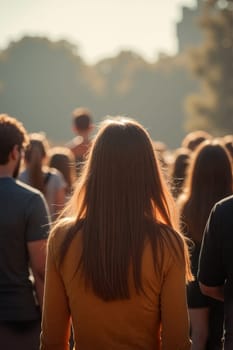 A large group of people gathers in a sunlit park, with individuals enjoying the atmosphere and engaging in conversation during an outdoor event. Generative AI.