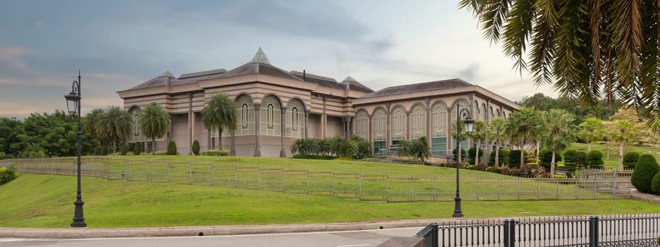 The Prime Minister's office in Bandar Seri Begawan, Brunei features intricate architecture, surrounded by vibrant greenery. This landmark represents Brunei's political significance and natural beauty