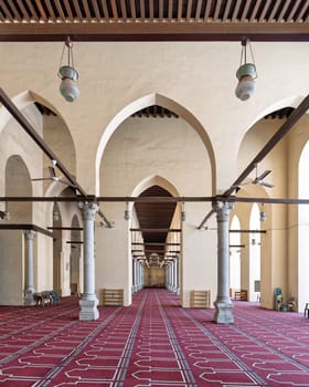 The Al-Zahir Baybars Mosque in Cairo stands as a testament to Egypt's profound Islamic heritage, renowned for its imposing columns, arched passages, and meticulously adorned prayer carpet