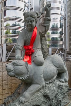 Kuala Lumpur, Malaysia - Feb.19, 2025: Statue no.20 of the 24 Filial Exemplars collection at Thean Hou Temple, depicts Yang Xiang, who fought a tiger to save his father