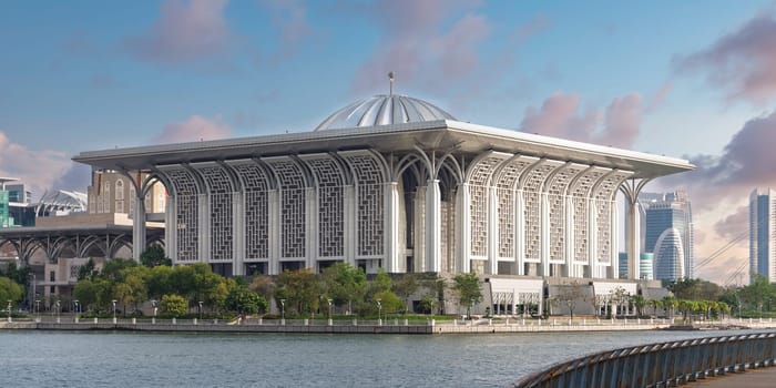 Exterior view of Tuanku Mizan Zainal Abidin Mosque, aka Iron Mosque, in Putrajaya, Malaysia, by the lake. A modern Islamic architecture landmark