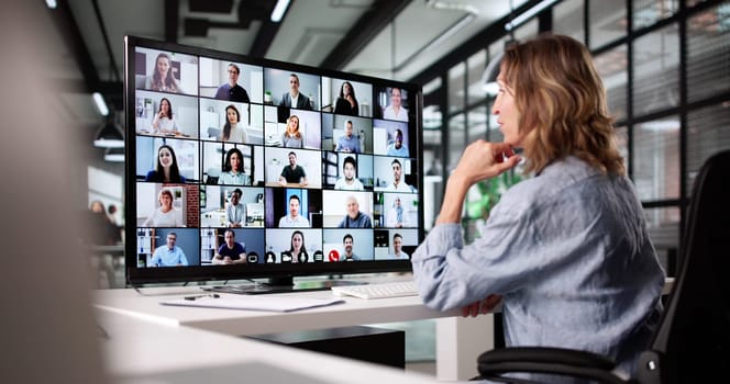 Professional Woman Leading Virtual Business Conference Call From Home Office.