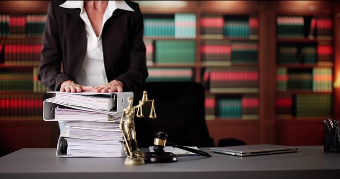 Professional Woman Juggling Files With Confidence And Grace In Office.