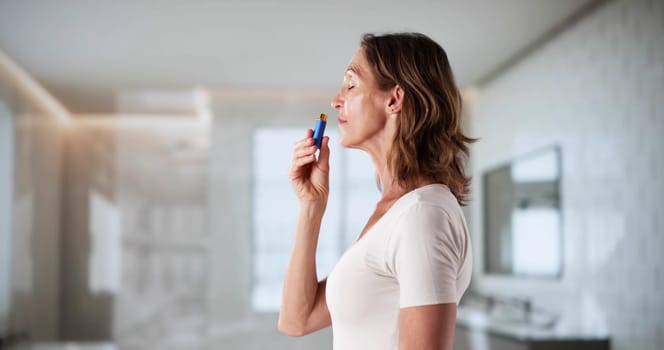 Herbal Aromatherapy: Woman Inhaling Essential Oil For Alternative Therapy