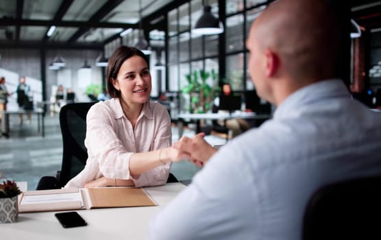 Successful Business Partnership Sealed With Handshakes And Smiles