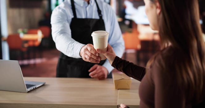 Female Barista Serving Cappuccino To Customer In Cozy Coffee Shop.