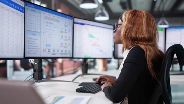 Businesswoman Utilizing Agile Project Management Software On Desktop Computer Screen