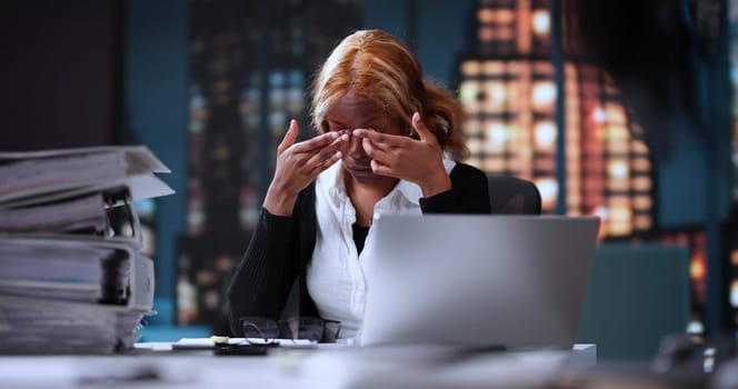 Exhausted Businesswoman Suffers From Eye Fatigue While Working Late At Night