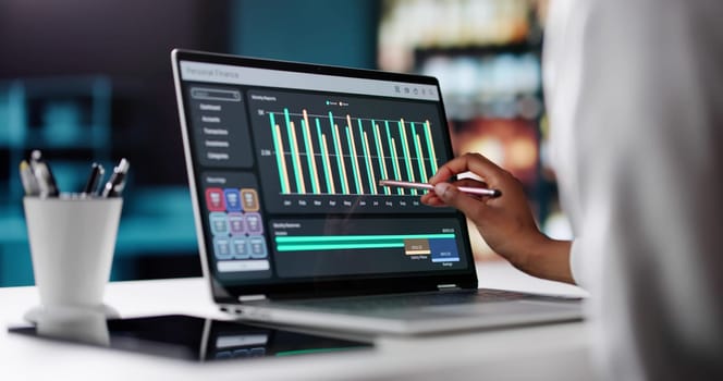 Efficiently Track Expenses Online Using Computerized Budgeting And Reporting Tool. African American Woman Using Laptop