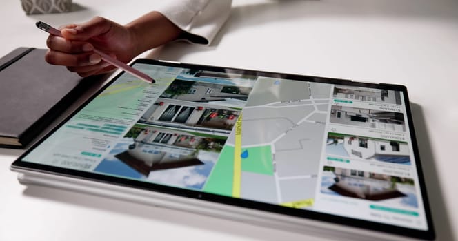 Browse Homes Online Using Real Estate Portal On Computer Map. Woman Using Laptop To Search For Houses To Rent Online
