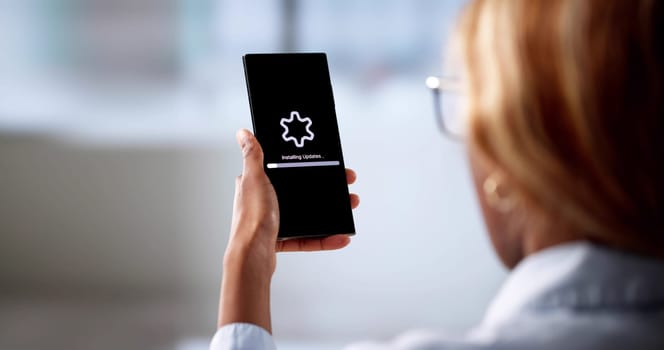 Woman Professional Installing New Software Update On Work Mobile Phone