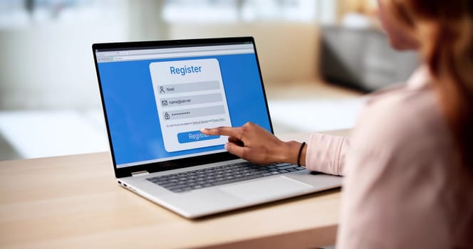 African American Woman Signing Up For User Account On Laptop